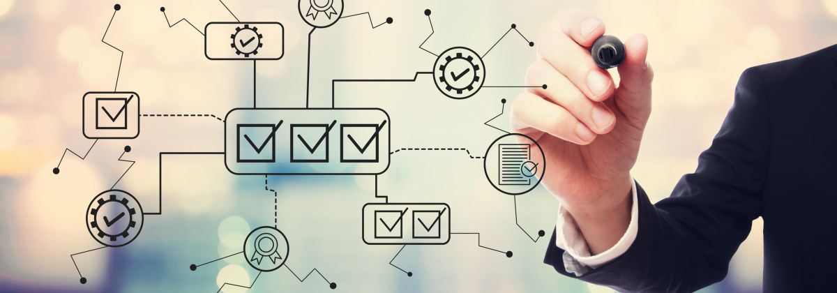 Businessperson drawing a digital checklist workflow with interconnected checkboxes, gears, and certification icons.